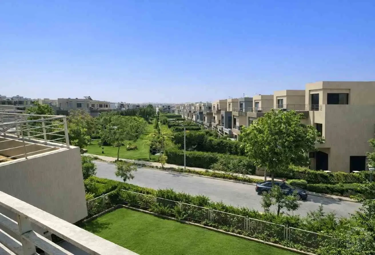 Panoramic Balcony View Over Green Spaces and Artificial Lake