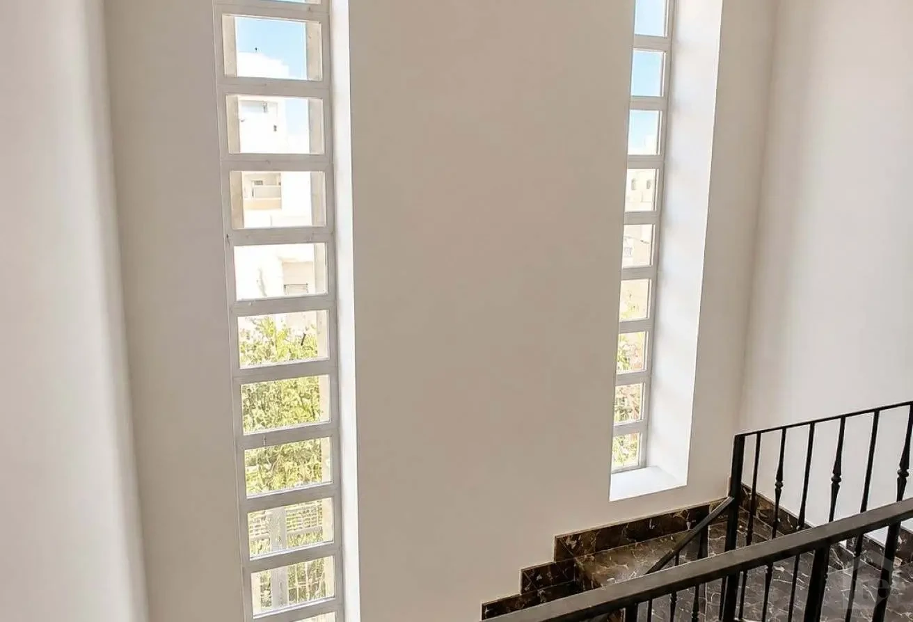 Interior Staircase Area Feature Vertical Glass Block Windows for Natural Light