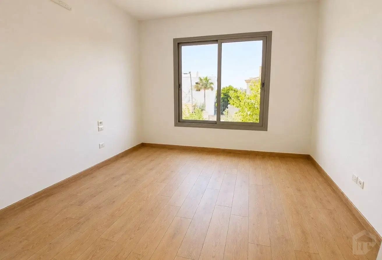 Interior Room with Modern Finishes, Parquet Flooring, and Large Windows