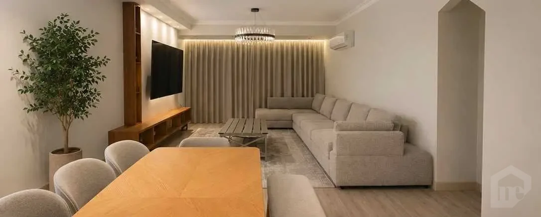 Elegant Living and Dining Room with Modern Furniture and Warm Lighting