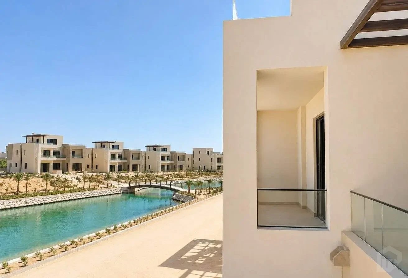 Front Facade of the Residential Complex Overlooking the Artificial Lake and Bridge