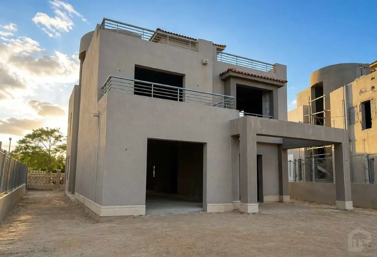 Side Facade of the Semi-Finished Villa Showing Open Balconies