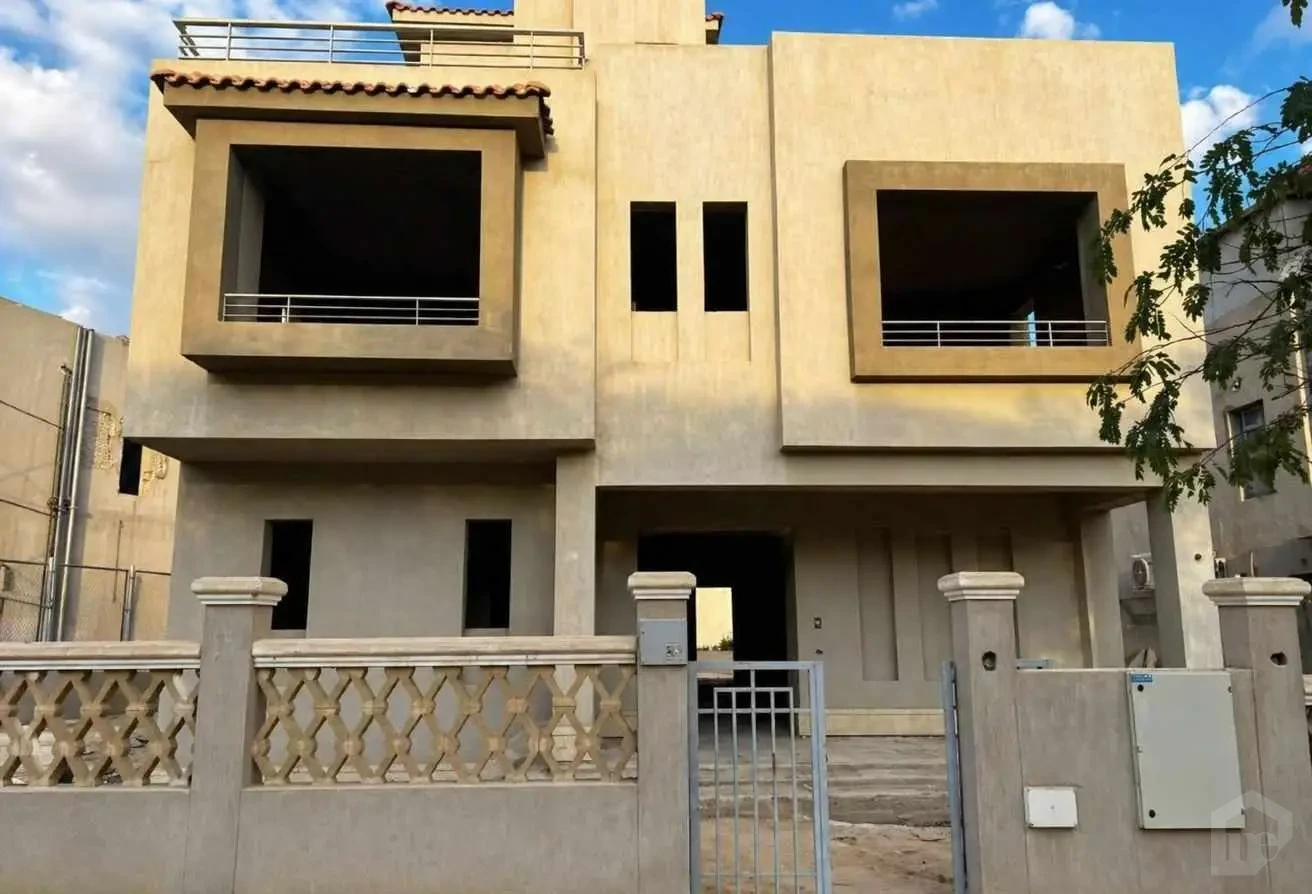 Front Facade of the Villa Under Construction with Exterior Wall and Gate